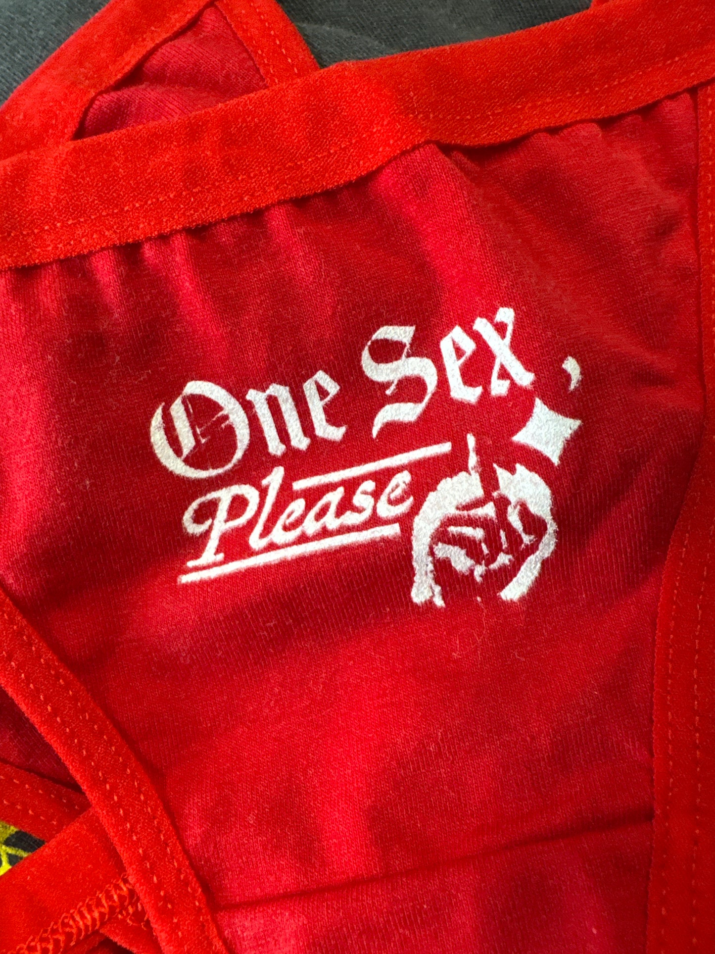 Red bag with white text and logo on a red background