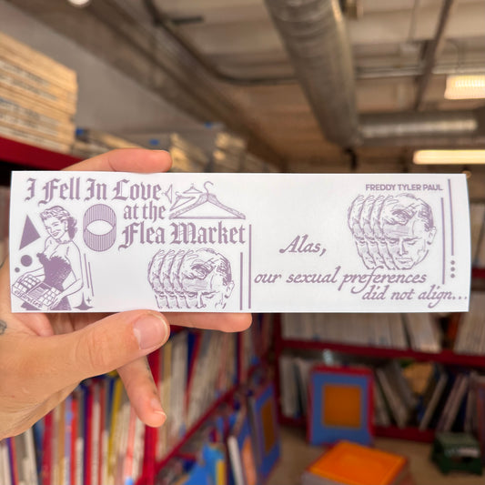 Hand holding a card with illustrations and text in a store setting