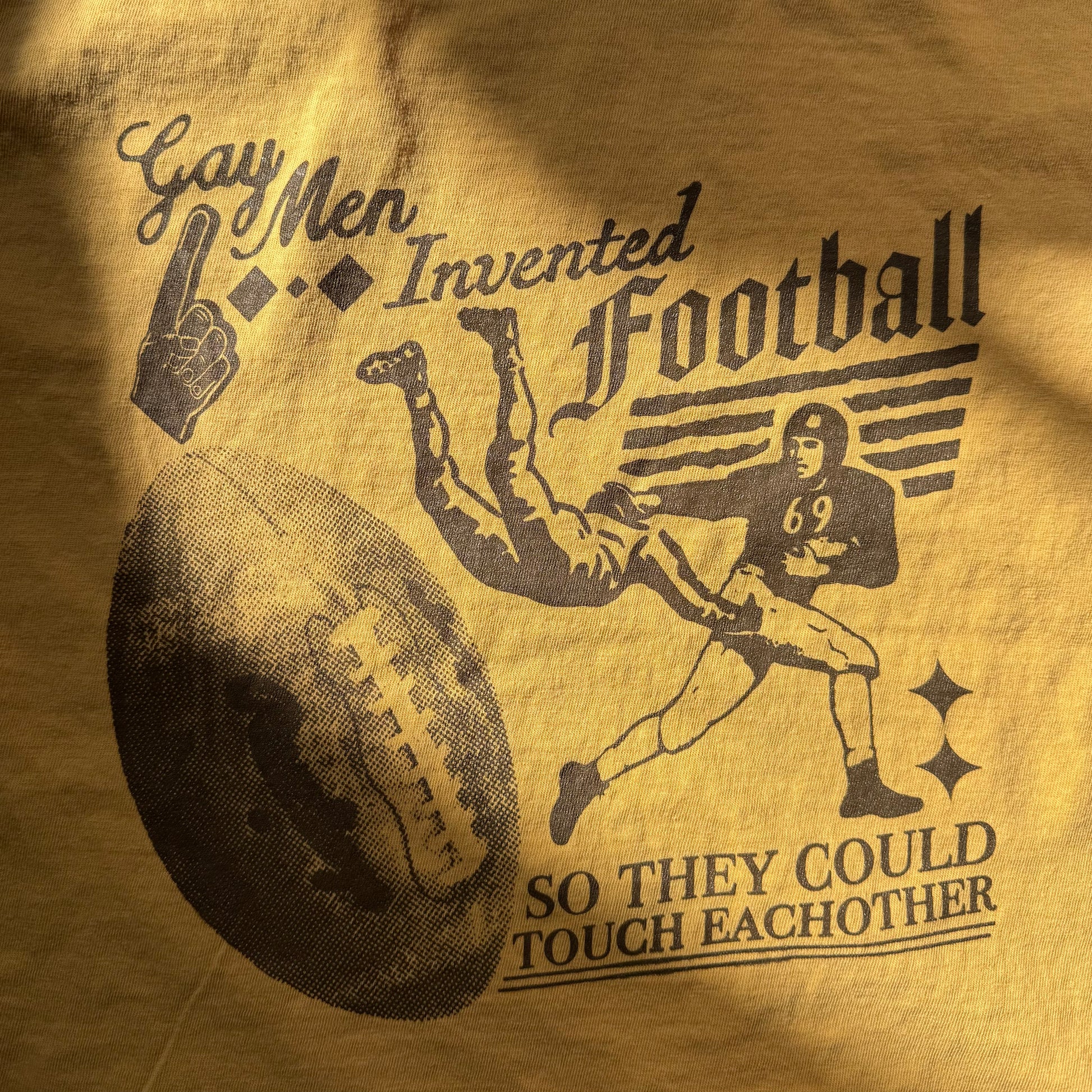 T-shirt with graphic of a football player and text on a brown background