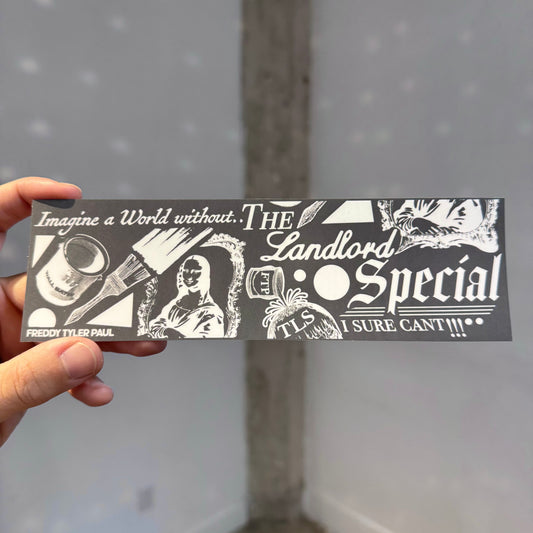 Hand holding a black and white sticker with text and graphics against a gray background