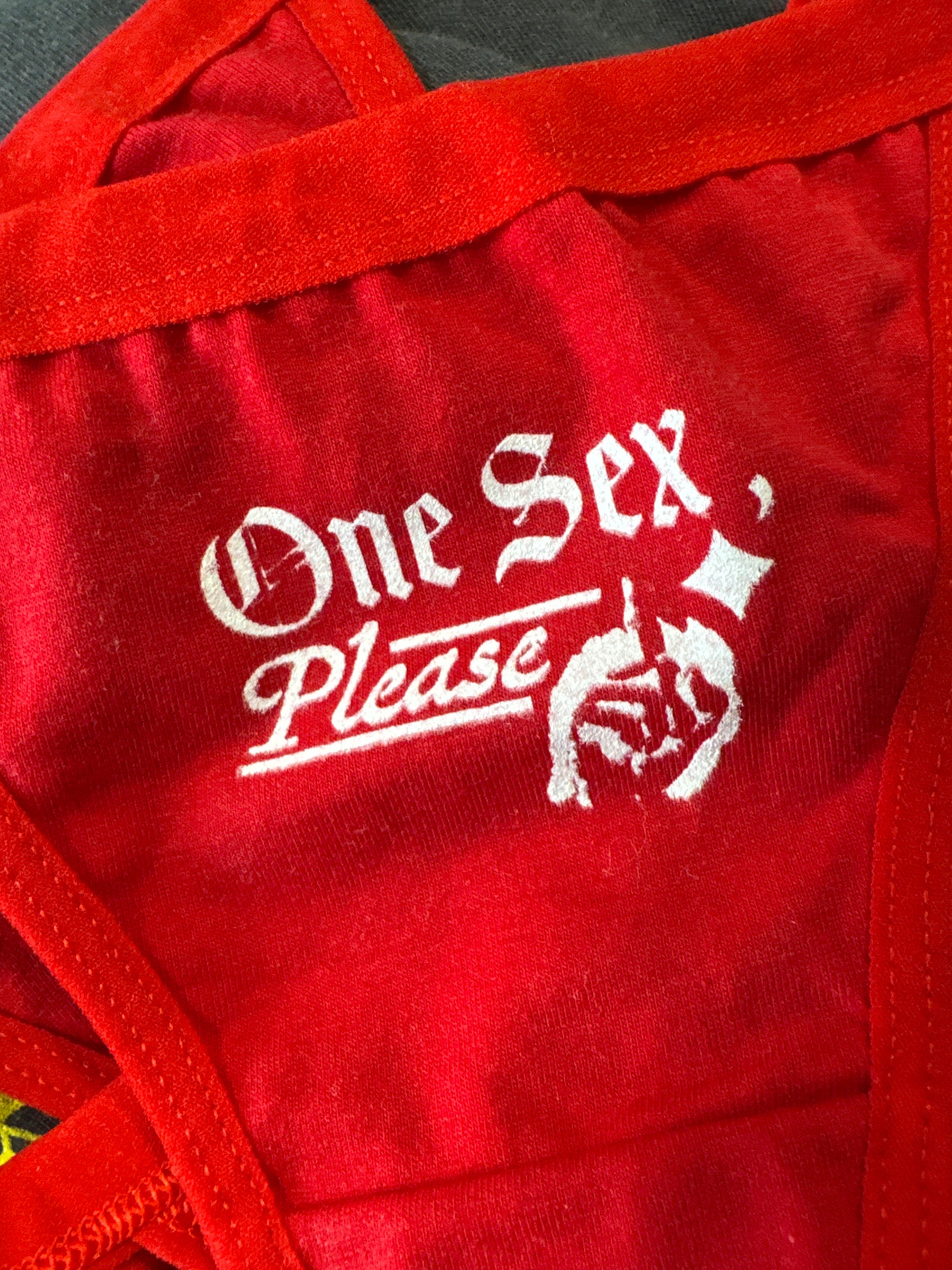 Red bag with white text and logo on a red background
